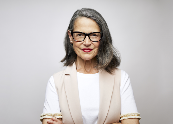 Photo of elderly woman looking confident while staring straight ahead