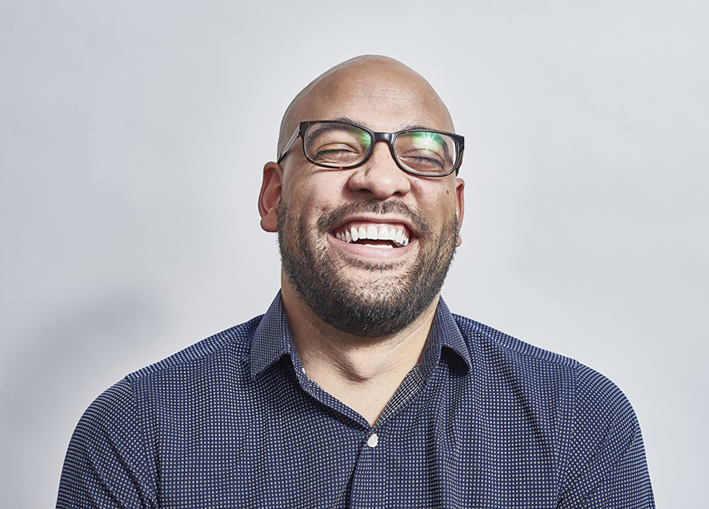 Photo of middle aged man happily smiling with eyes closed